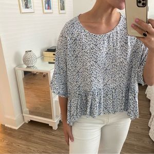 Flowy spotted top with ruffle detail